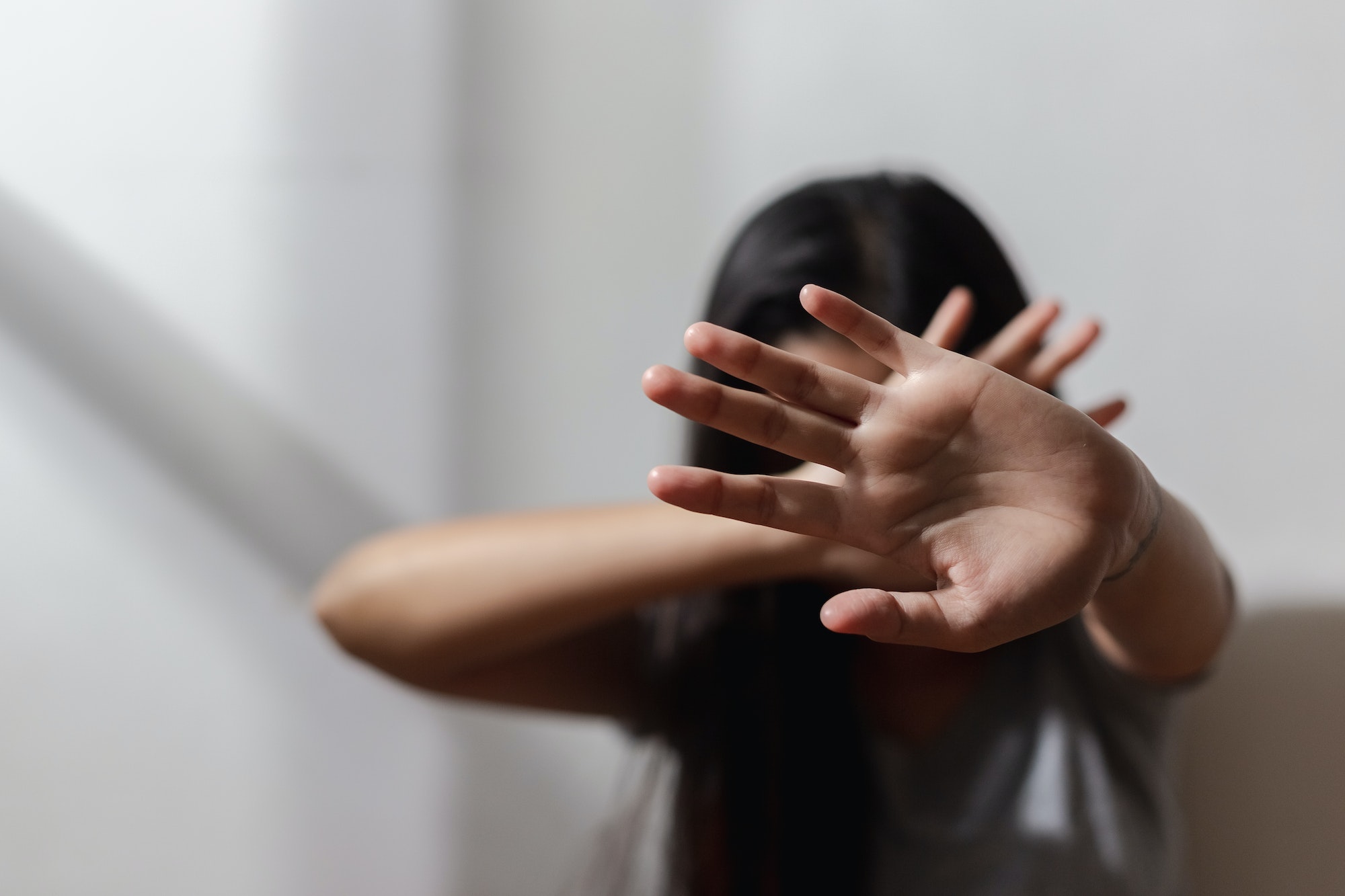 Close up focus of hand woman showing to stop violence fear abuse. domestic pain,